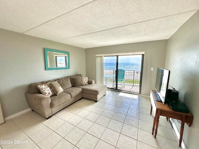 tiled living room with a textured ceiling