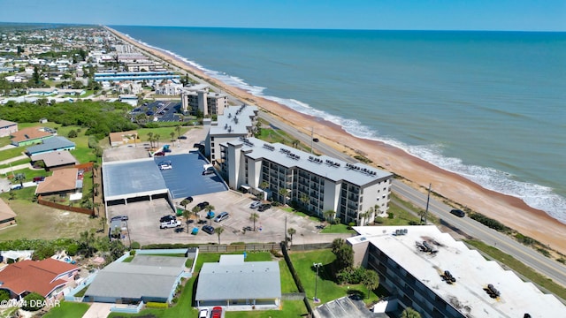 bird's eye view with a view of the beach and a water view