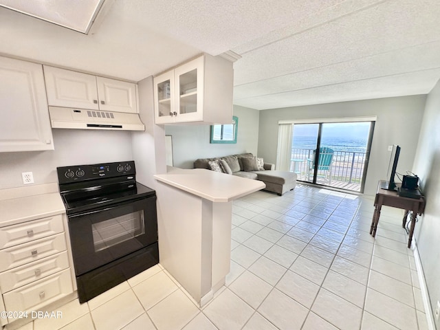 kitchen with white cabinets, kitchen peninsula, a textured ceiling, light tile patterned floors, and black range with electric stovetop