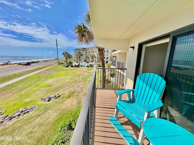 balcony featuring a water view