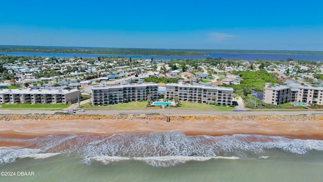 drone / aerial view with a water view and a view of the beach