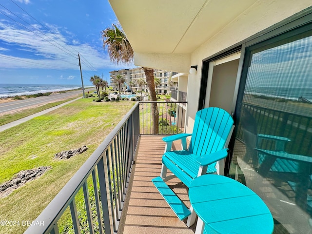 balcony featuring a water view