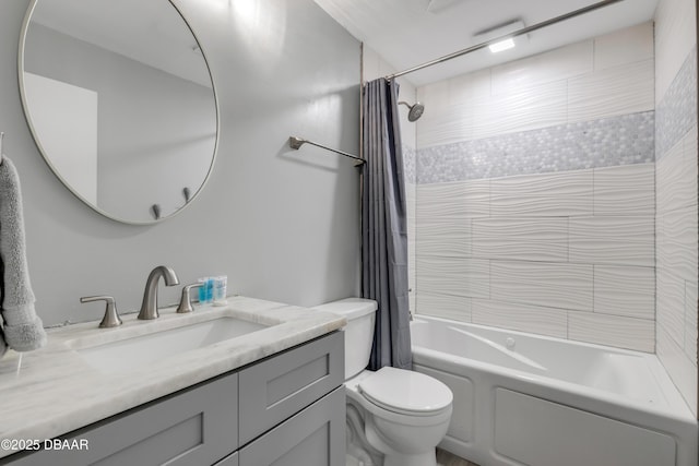 full bathroom featuring shower / bath combo with shower curtain, vanity, and toilet