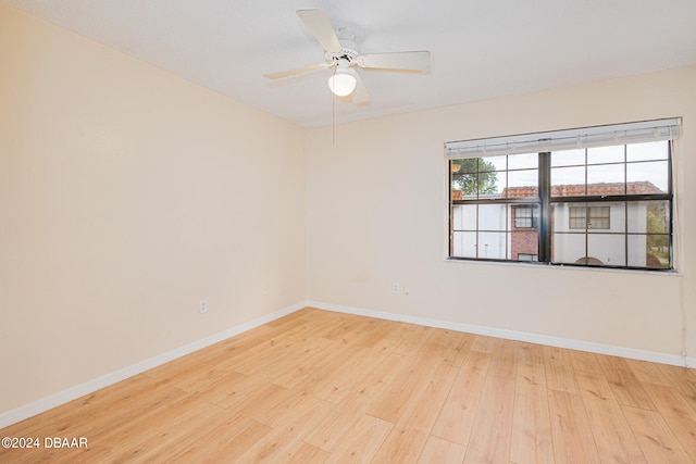 unfurnished room featuring ceiling fan and light hardwood / wood-style flooring