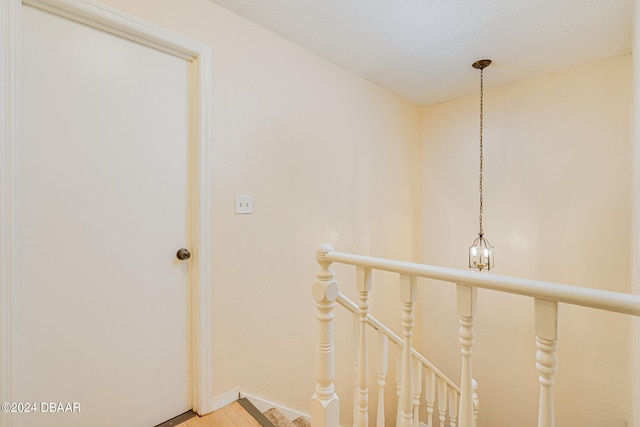 corridor with a chandelier