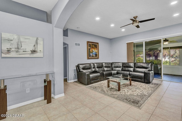 tiled living room with ceiling fan