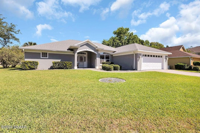 single story home featuring a front yard and a garage