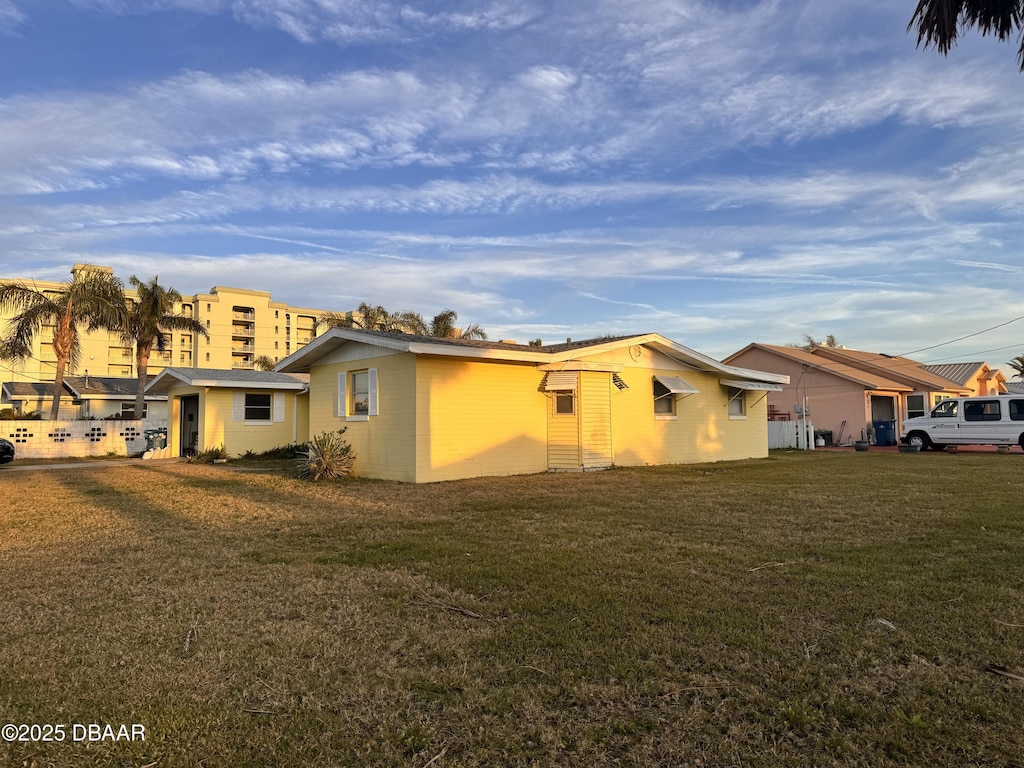 view of property exterior featuring a lawn