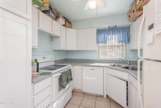 kitchen with ceiling fan, sink, light tile patterned floors, white appliances, and white cabinets