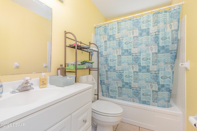 full bathroom featuring tile patterned flooring, shower / tub combo with curtain, vanity, and toilet