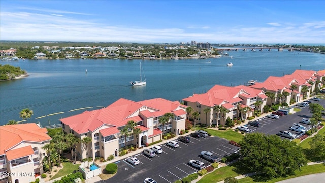 birds eye view of property featuring a water view