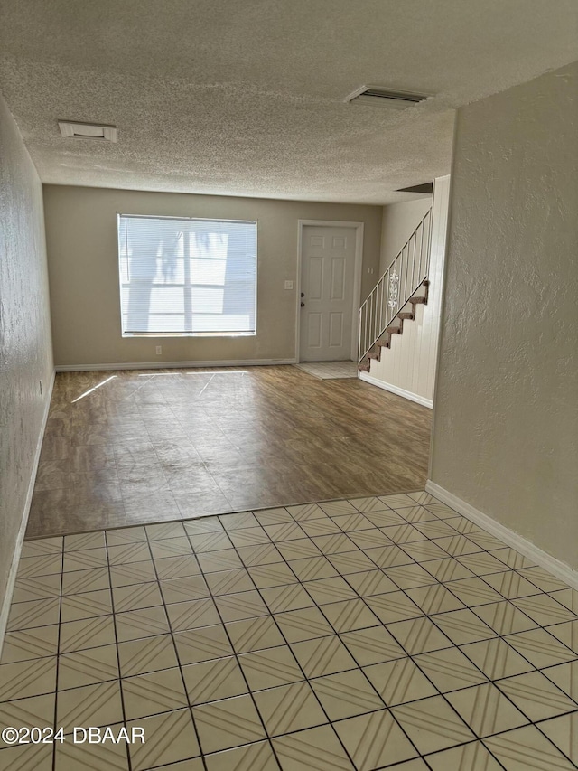 interior space with a textured ceiling