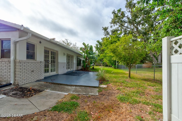 3630 Scott St, Port Orange, FL 32129 - view of yard featuring french doors and a patio