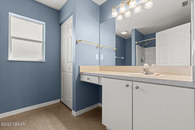 full bathroom featuring visible vents, baseboards, walk in shower, tile patterned floors, and vanity