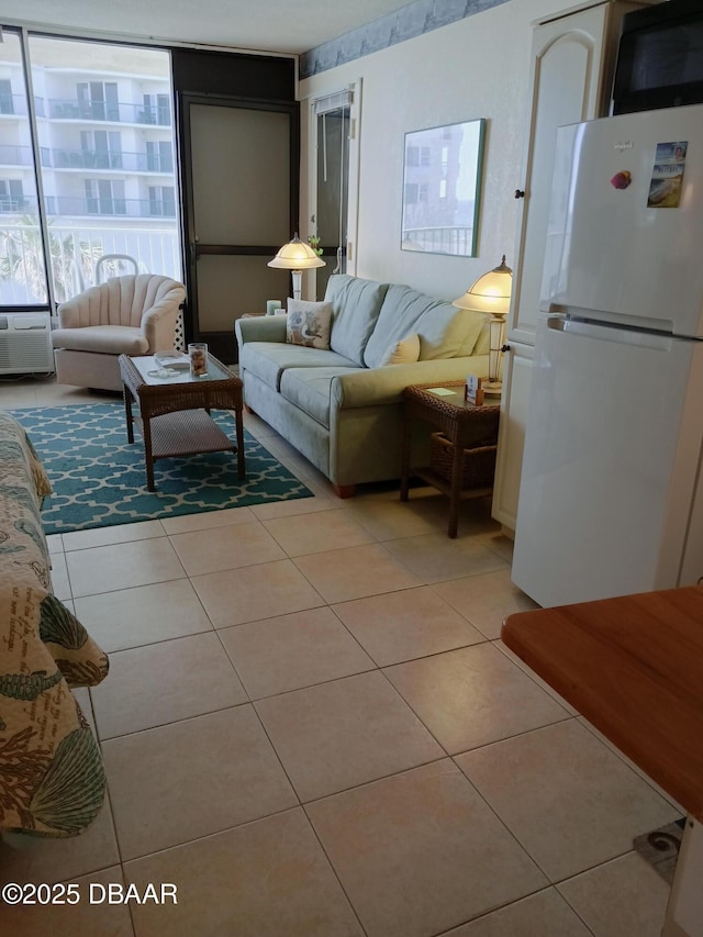 2043 S Atlantic Ave Unit 311, Daytona Beach, FL 32118 - living area with light tile patterned floors