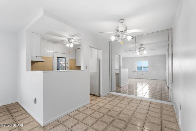 3009 N Halifax Ave Unit 9, Daytona Beach, FL 32118 - empty room featuring baseboards and a ceiling fan