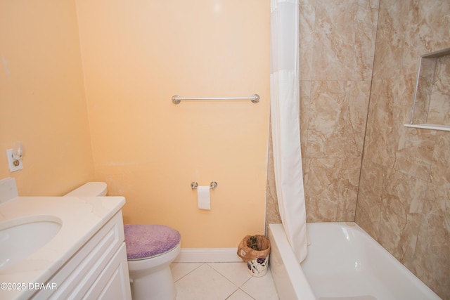 bathroom featuring tile patterned flooring, toilet, vanity, baseboards, and shower / bath combo