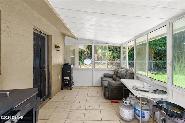 sunroom featuring wood ceiling and vaulted ceiling