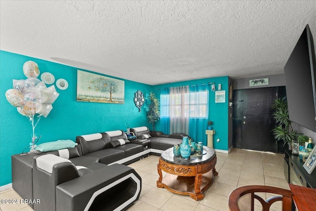 tiled living room featuring a textured ceiling