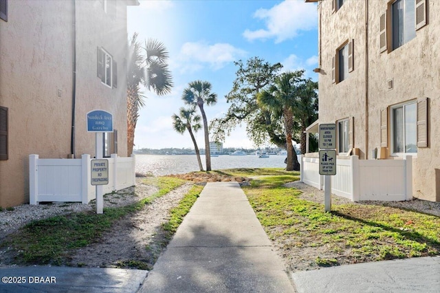 surrounding community featuring a water view