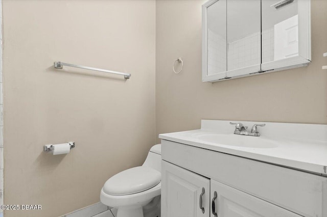 bathroom featuring vanity and toilet