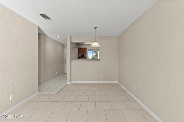 spare room featuring a textured ceiling