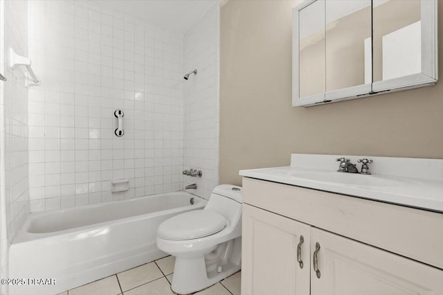 full bathroom with vanity, tiled shower / bath, tile patterned floors, and toilet