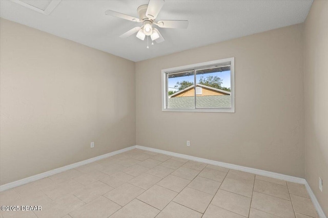 empty room with light tile patterned flooring and ceiling fan