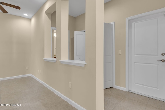 corridor with light tile patterned floors