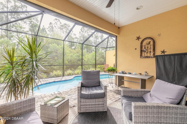 view of patio / terrace featuring an outdoor living space and a lanai