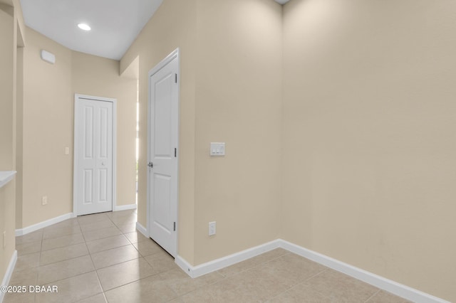 hallway with light tile patterned floors