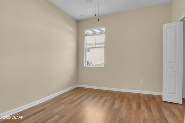 empty room with light hardwood / wood-style floors