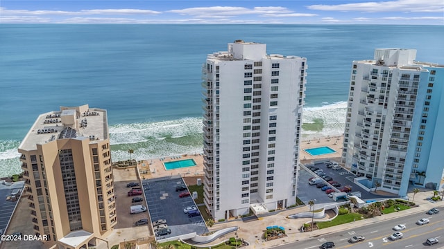 bird's eye view with a water view and a view of the beach