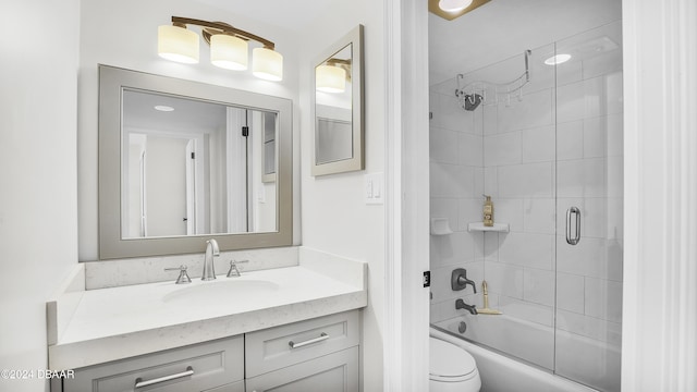 full bathroom with vanity, toilet, and enclosed tub / shower combo