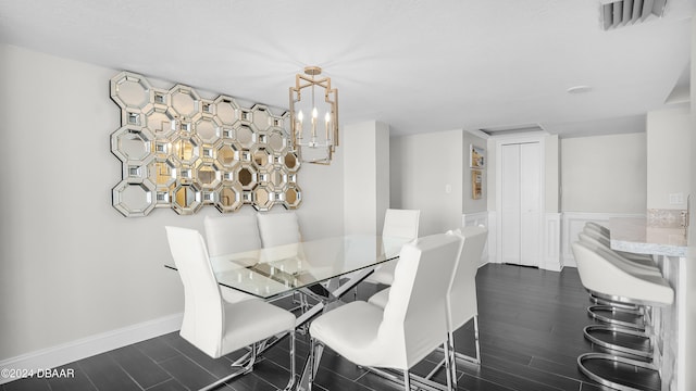 dining room featuring a chandelier and dark hardwood / wood-style flooring