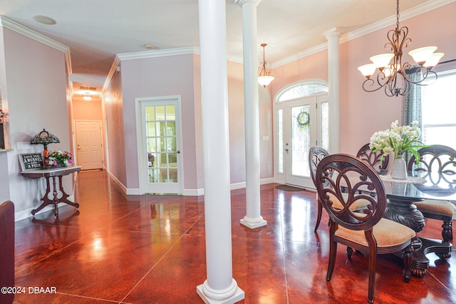 dining space with decorative columns, a chandelier, a healthy amount of sunlight, and ornamental molding