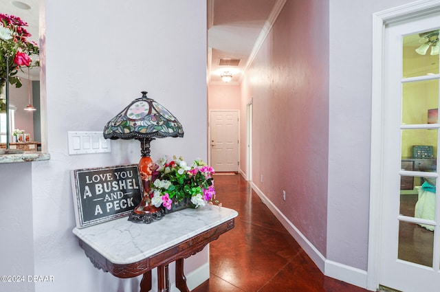 hall featuring ornamental molding