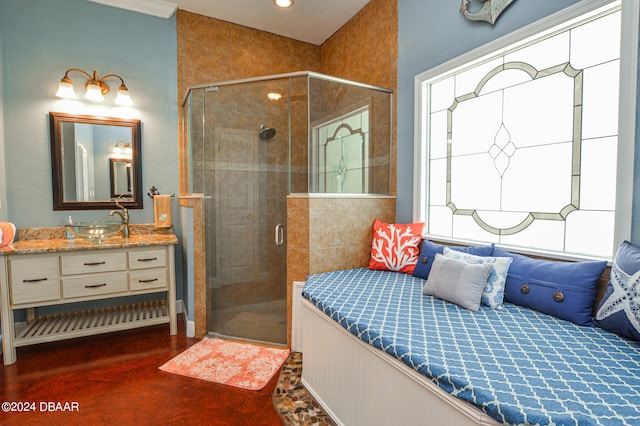 bathroom featuring an enclosed shower and vanity