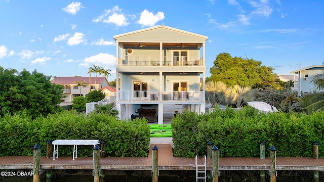 back of house featuring a balcony