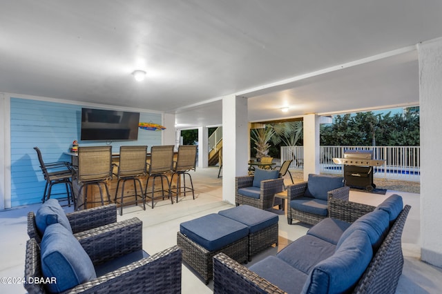 view of patio / terrace featuring an outdoor bar, outdoor lounge area, and grilling area