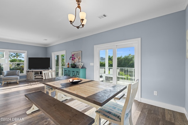 dining room featuring dark wood-type flooring and a notable chandelier