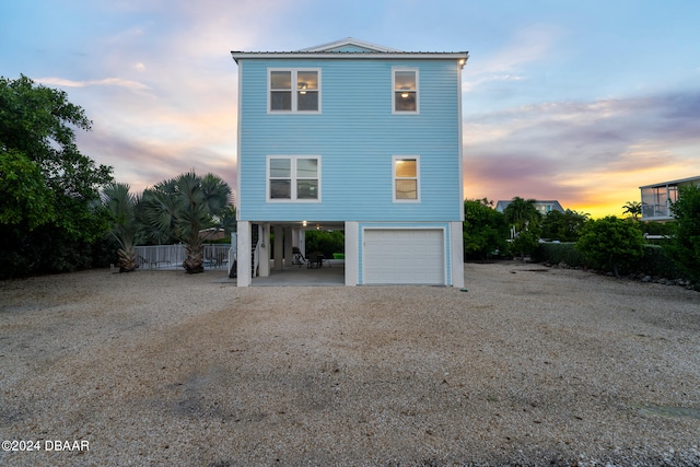 property exterior at dusk with a garage