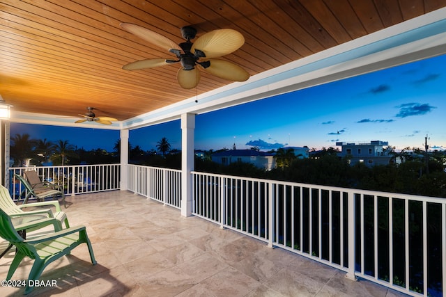 view of patio / terrace with ceiling fan and a balcony