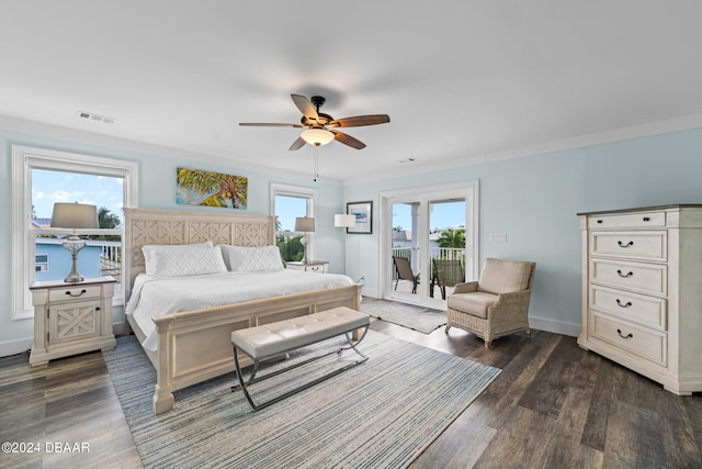 bedroom featuring ornamental molding, ceiling fan, access to exterior, dark hardwood / wood-style flooring, and french doors