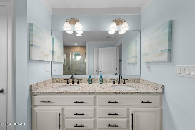 bathroom featuring vanity and a shower with door