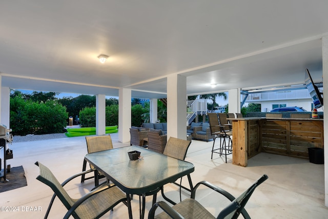 view of patio with outdoor lounge area and an outdoor bar