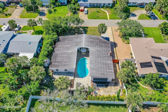 aerial perspective of suburban area featuring a pool
