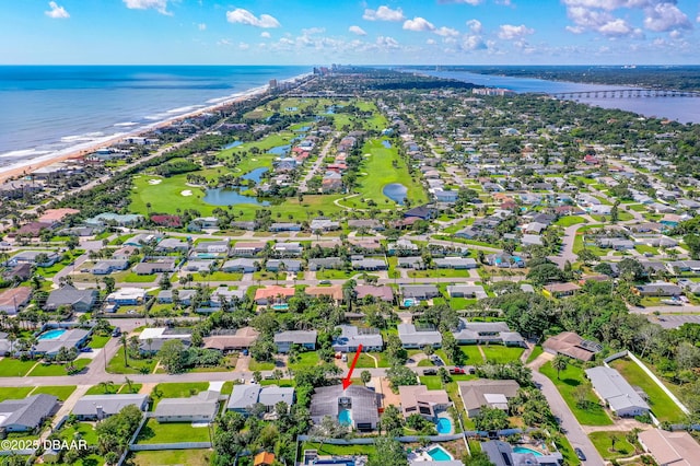 view of property location featuring a nearby body of water and nearby suburban area