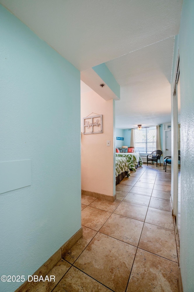 hallway with light tile patterned floors