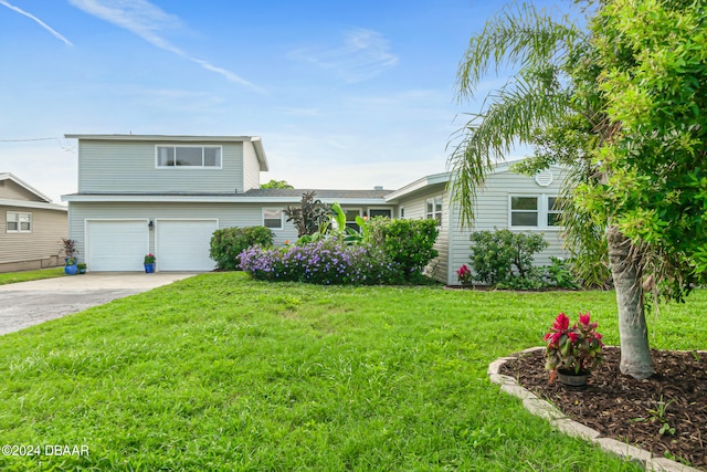 view of front facade featuring a garage and a front yard